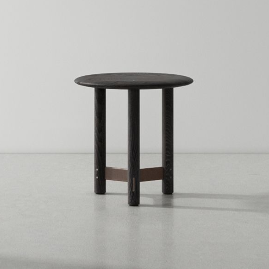 Black side table on a gray floor with a neutral background #Timber Finishing_Ebonized Oak